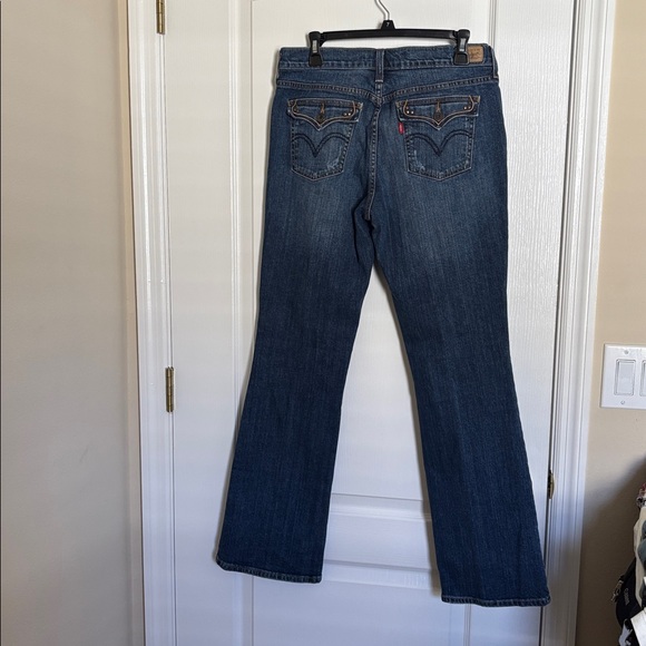 Levi's 515 Dark Blue Boot Cut Mid-Rise Slight Distressing Jeans - Picture 6 of 9